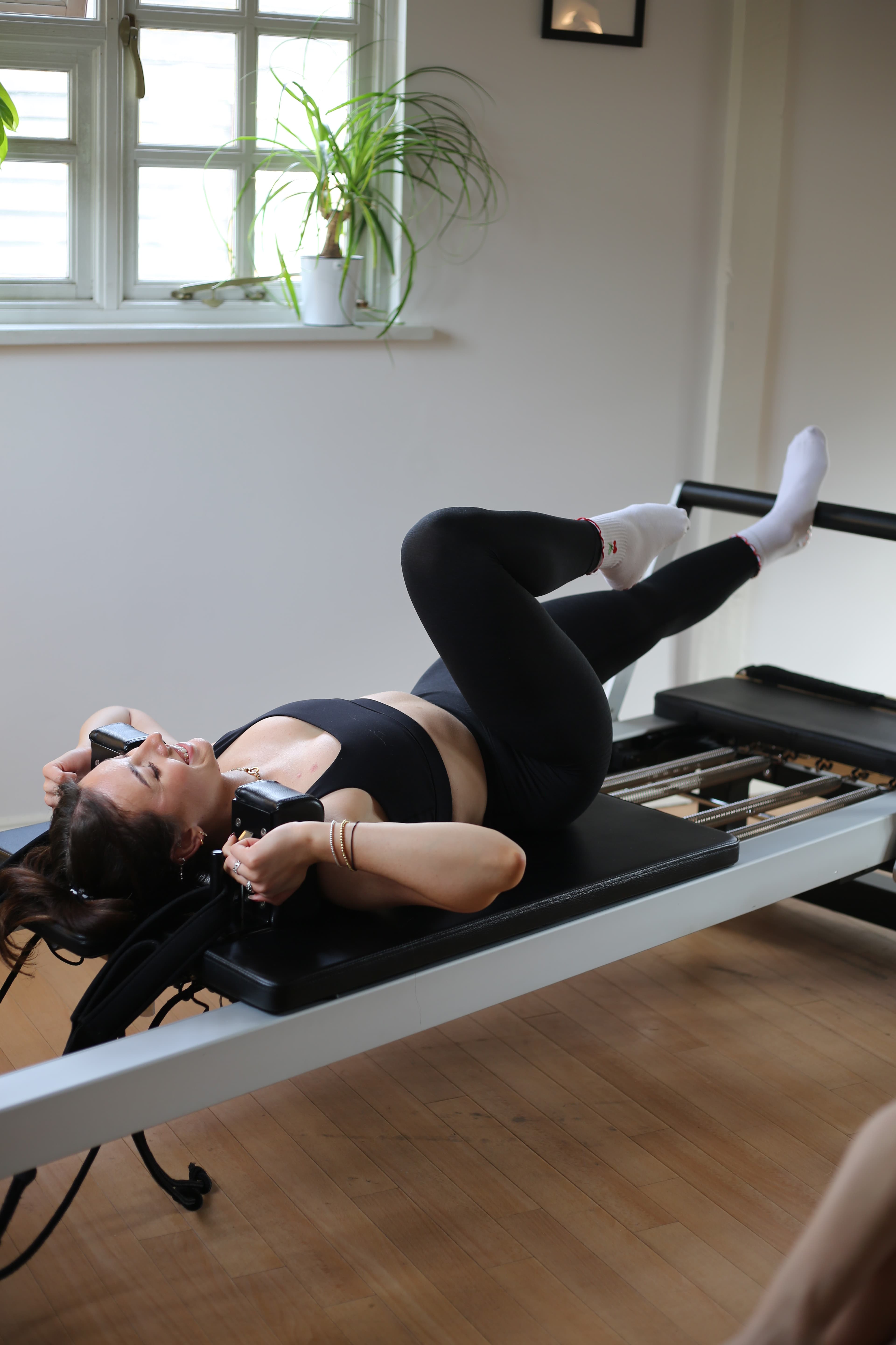 A member mid-class at The Mvement Studio